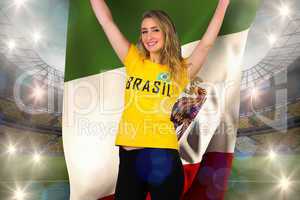 Excited football fan in brasil tshirt holding mexico flag