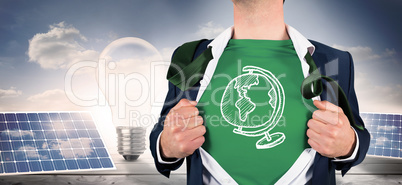 Composite image of businessman opening shirt in superhero style