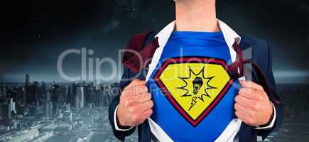 Composite image of businessman opening shirt in superhero style