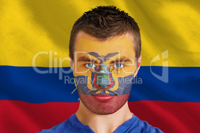 Serious young ecuador fan with facepaint