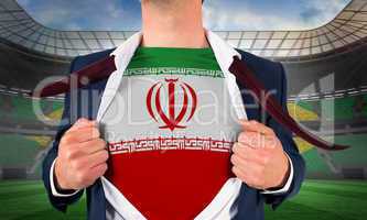 Businessman opening shirt to reveal iran flag