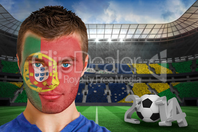 Serious young portuguese fan with face paint