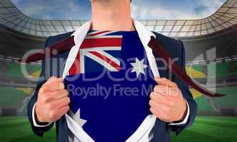 Businessman opening shirt to reveal australia flag