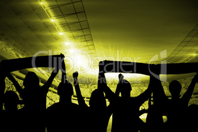 Silhouettes of football supporters