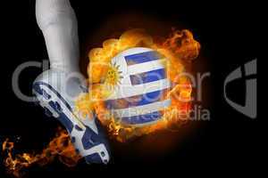 Football player kicking flaming uruguay ball