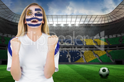 Excited fan in uruguay face paint cheering