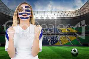 Excited fan in uruguay face paint cheering