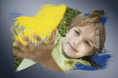 Composite image of little boy smiling at camera