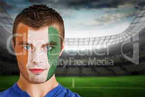 Ivory coast football fan in face paint