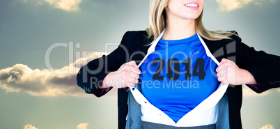 Composite image of businesswoman opening her shirt superhero sty