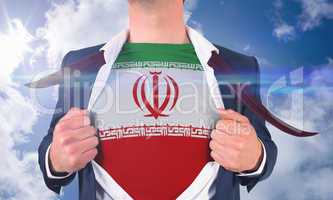 Businessman opening shirt to reveal iran flag