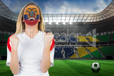 Excited ecuador fan in face paint cheering