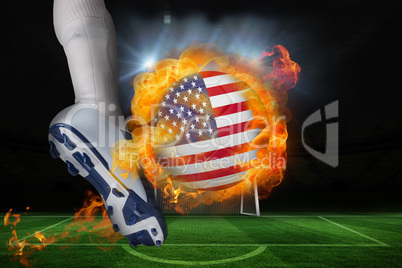 Football player kicking flaming usa flag ball