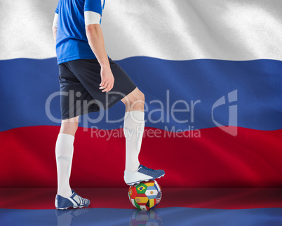 Football player standing with ball