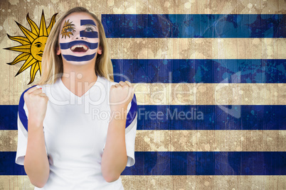 Excited fan in uruguay face paint cheering