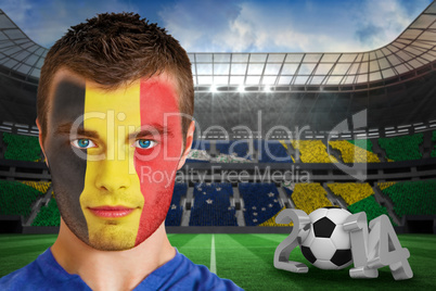 Serious young belgium fan with face paint