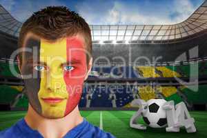 Serious young belgium fan with face paint