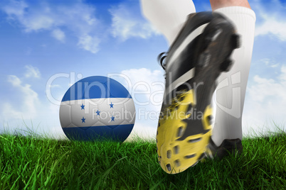 Football boot kicking honduras ball