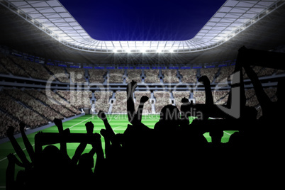 Silhouettes of football supporters