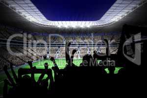 Silhouettes of football supporters