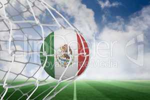 Football in mexico colours at back of net