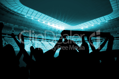 Silhouettes of football supporters