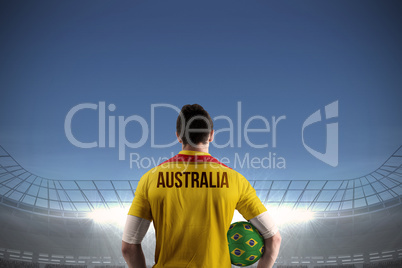 Australia football player holding ball