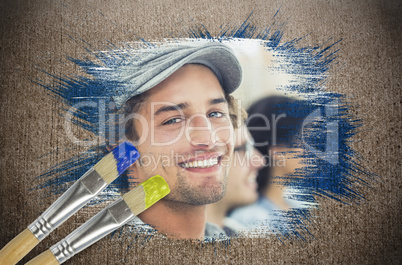 Composite image of designer smiling at camera