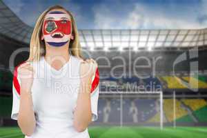 Excited costa rica fan in face paint cheering