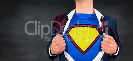 Composite image of businessman opening shirt in superhero style