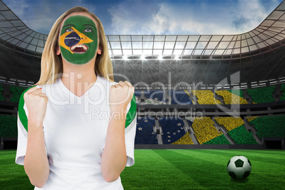 Excited brasil fan in face paint cheering