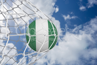 Football in nigeria colours at back of net