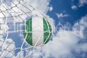 Football in nigeria colours at back of net
