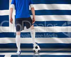 Football player standing with ball