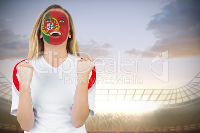 Excited portugal fan in face paint cheering