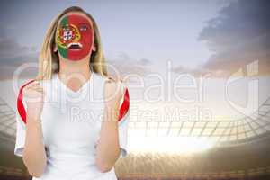 Excited portugal fan in face paint cheering