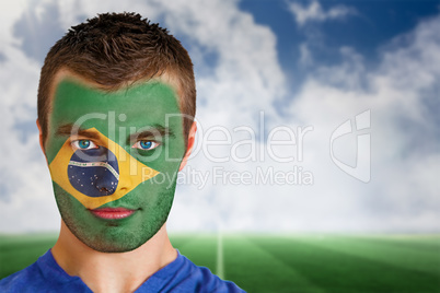 Brazil football fan in face paint