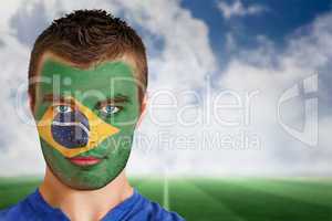 Brazil football fan in face paint