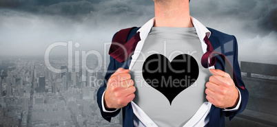 Composite image of businessman opening shirt in superhero style