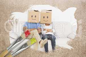 Composite image of couple wearing boxes on head