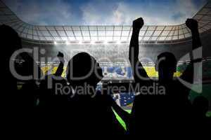 Silhouettes of football supporters