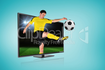 Football player kicking ball through tv