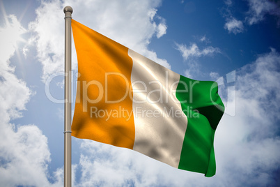 Ivory coast national flag on flagpole