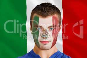 Serious young mexico fan with facepaint