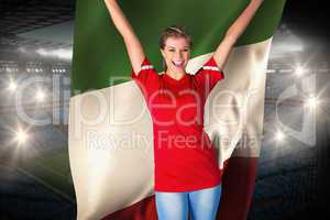 Cheering football fan in red holding italy flag