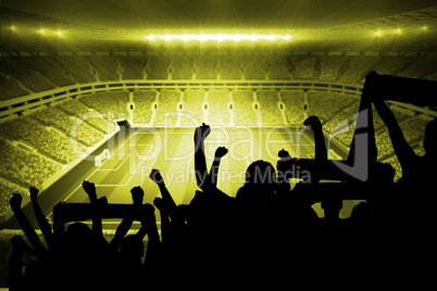 Silhouettes of football supporters