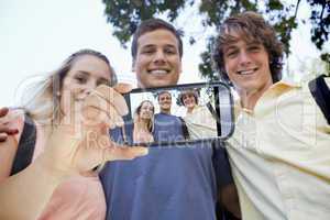 Composite image of hand holding smartphone showing