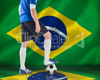 Football player standing with ball