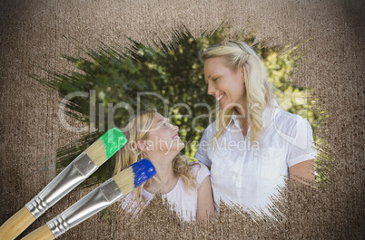 Composite image of mother and daughter in the park