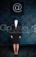 Composite image of headless businesswoman with at sign